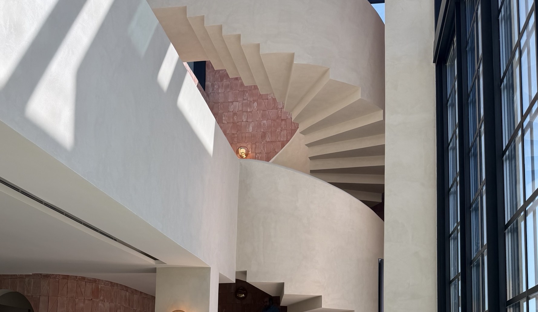 Plastered spiral staircase in a finished villa