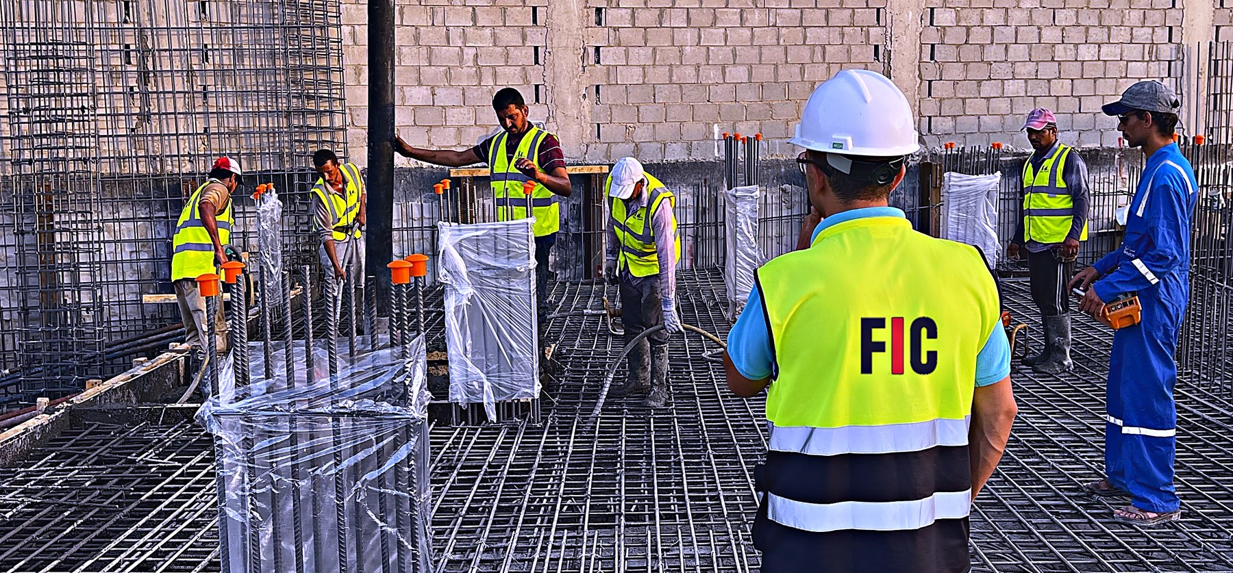 FIC site team fixing reinforcement ahead of a slab pour